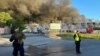 Полицейские работают на месте пожара в торговом центре Marywilska 44 в Варшаве, Польша, 12 мая 2024 года. 11 мая этого года власти Польши официально обвинили российские спецслужбы в его поджоге