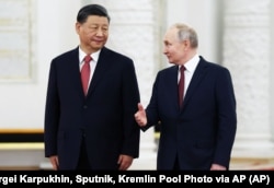 Голова Китаю Сі Цзіньпін (ліворуч) і президент Росії Володимир Путін. Москва, 21 березня 2023 року