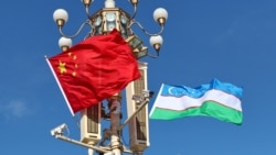 CHINA -- The national flags of Uzbekistan and China flutter at Tian'anmen Square on January 23, 2024 in Beijing, China. 