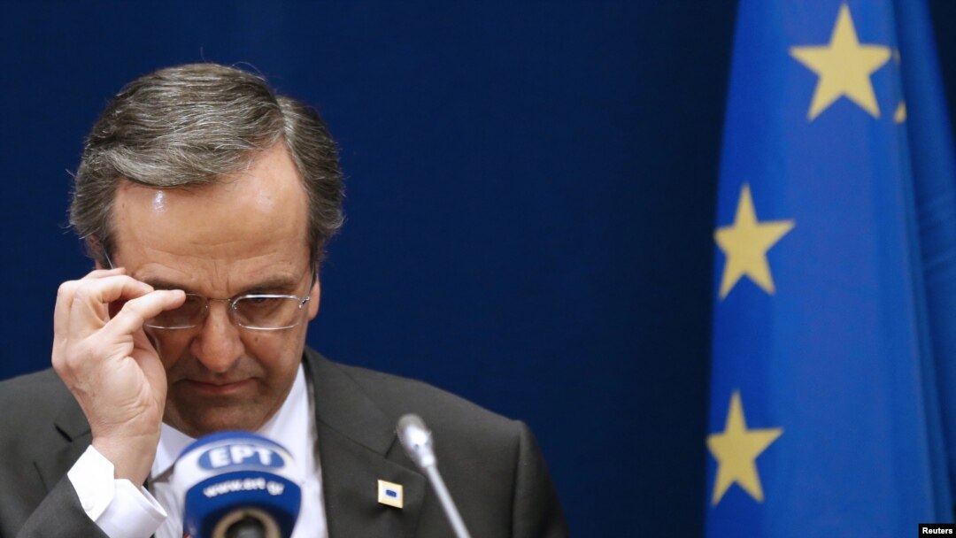 Greek Prime Minister Antonis Samaras adjusts his glasses at a two-day EU leaders summit in Brussels in October, 2012.