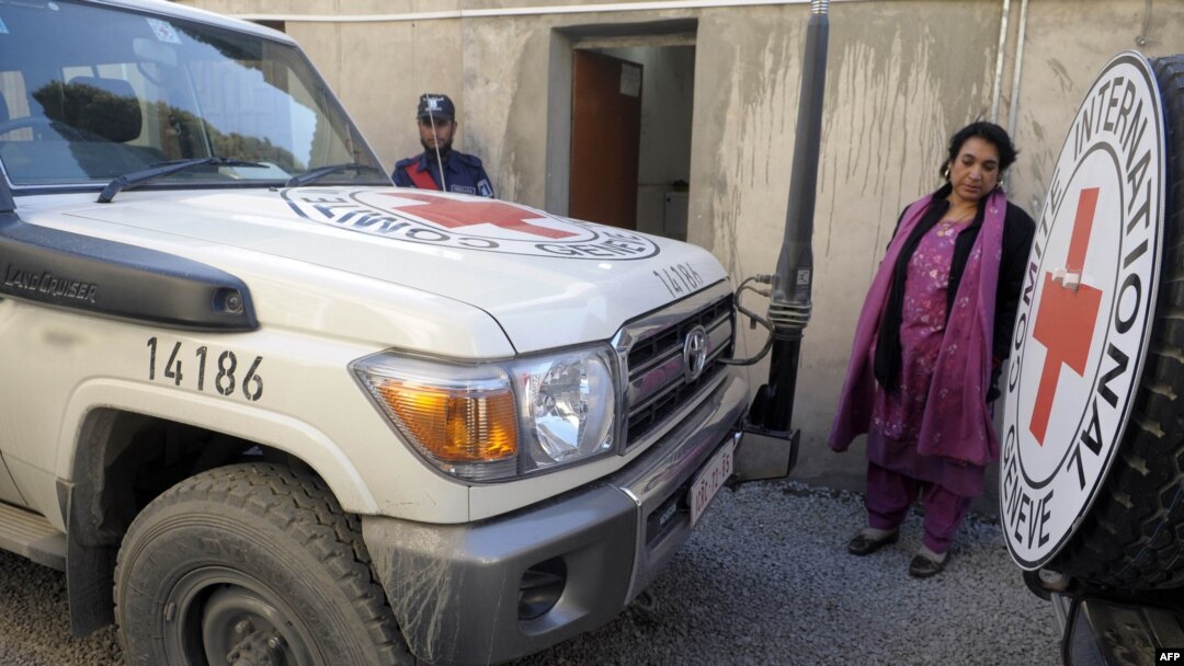 A Pakistani employee of the International Committee of the Red Cross stands next to the vehicle from which British employee Khalil Dale was kidnapped in Quetta.