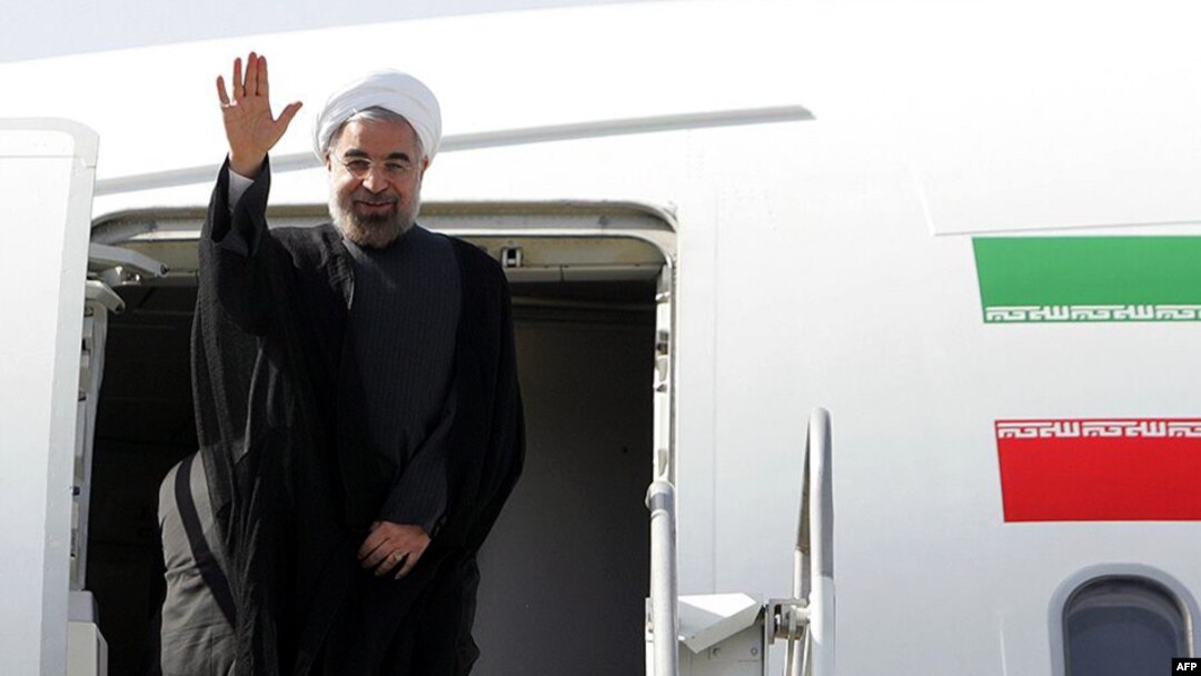 Iranian President Hassan Rohani waves before departing for the United States to attend the UN General Assembly on September 23
