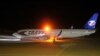 A Czech aircraft taxis before takeoff at Leipzig's airport on October 24, believed to be carrying the rejected asylum seekers, 11 of whom had criminal records.