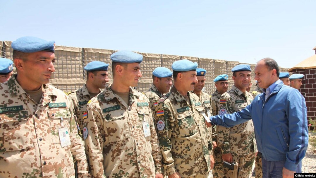 Armenian Defense Minister Seyran Ohanian inspects Armenian troops serving in Afghanistan in July.