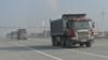 Armenia - Trucks pass through a newly expanded highway running south of Yerevan, 29Dec2015. 