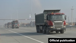 Armenia - Trucks pass through a newly expanded highway running south of Yerevan, 29Dec2015. 