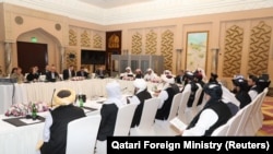 د قطر په دوحه کې د امریکايي او طالب مرکچي پلاویو ترمنځ د سولې د خبرو غونډه.