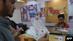 A Pakistani cricket fan buy ticket for the last T20 cricket match to be played between Pakistan and Sri Lanka.