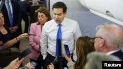 US Secretary of State Rubio speaks with reporters on his plane while flying from Suriname to Miami on March 27.