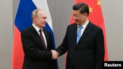 Президент России Владимир Путин и председатель КНР Си Цзиньпин.