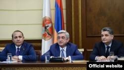 Armenia -- President Serzh Sarkisian (C) introduces new Prime Minister Hovik Abraamian (L) and thanks outgoing Prime Minister Tigran Sarkisian (R), Yerevan, 13Apr2014