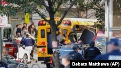 Authorities inspect a damaged school bus after the terrorist attack in New York on October 31.