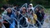 Hungary -- Migrants make their way after crossing the border at Zakany, Hungary October 16, 2015. 