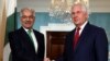 FILE: U.S. Secretary of State Rex Tillerson (R) shakes hands with Pakistan's Foreign Minister Khawaja Muhammad Asif in Washington on October 4