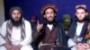 Omar Khalid Khorasani, center, a top Pakistan Taliban commander, gives an interview in Pakistan's Mohmand tribal region in 2011.
