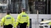 British police officers patrol in front of New Scotland Yard, central London. (file photo)