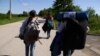GRAB - Camped Out In War-Damaged Bosnian Villages, Afghan Migrants Make Repeat Runs For EU Border
