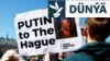 Halkara Adalat Kazyýetiniň binasynyň daşyndaky protestçiler Russiýanyň lideri Wladimir Putiniň tussag edilmegini talap etdiler. Haaga, Hollandiýa, 2024-nji ýylyň 7-nji maýy