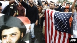 Supporters of anti-U.S. Shi'ite cleric Muqtada al-Sadr gather in downtown Baghdad on April 9.