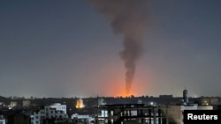 Smoke rises in the sky following US-led airstrikes in Sanaa, Yemen, in February.